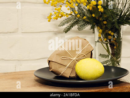 Easter yellow mimosa egg background Stock Photo