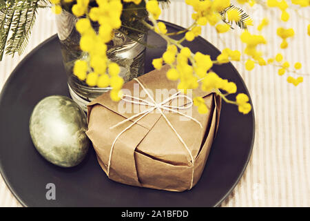 Easter yellow mimosa egg background Stock Photo