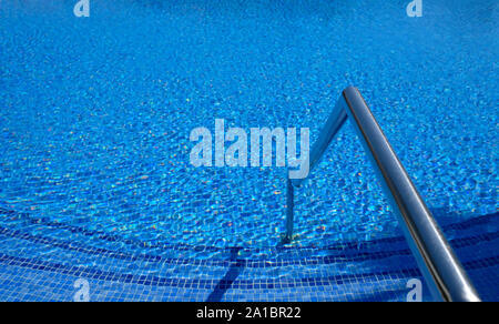 Ripples on the surface of an outdoor pool on a sunny day Stock Photo