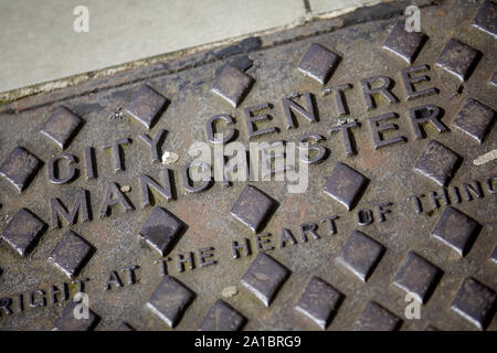 Manchester man-hole cover with City Centre Manchester embossed Stock Photo