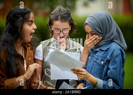 GCSe results 2019 Whalley Range 11-18 High School in Manchester  friends happy to get their results Stock Photo