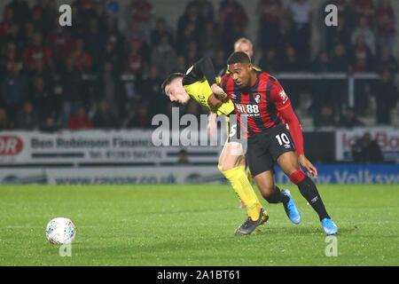 Burton Upon Trent, UK. 25th Sep, 2019. Jordon Ibe of Bournemouth (10) tussles with Reece Hutchinson of Burton Albion (15) during the EFL Carabao Cup match between Burton Albion and Bournemouth at the Pirelli Stadium, Burton upon Trent, England on 25 September 2019. Photo by Mick Haynes. Editorial use only, license required for commercial use. No use in betting, games or a single club/league/player publications. Credit: UK Sports Pics Ltd/Alamy Live News
