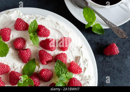 Meringue with whipped cream, raspberries.and mint Stock Photo