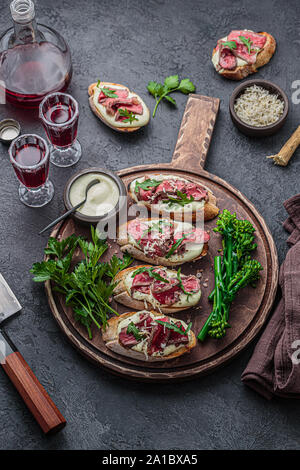 Tapas with roast beef on crusty bread, copy space. Stock Photo