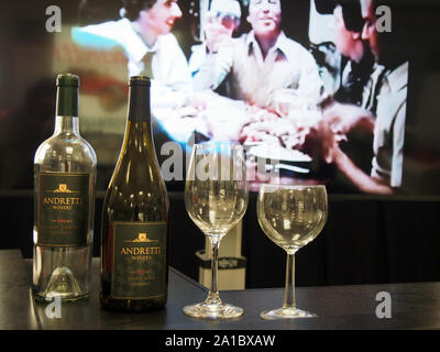 Andretti Winery wine display with video imagery of Mario Andretti in background at the Indianapolis Motor Speedway Museum, Indiana, July 28, 2019, © K Stock Photo