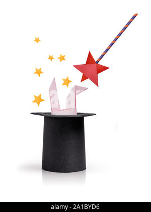 Magic wand with rabbit ears in cylinder hat Stock Photo