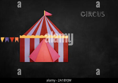 Circus Tent origami paper on blackboard Stock Photo