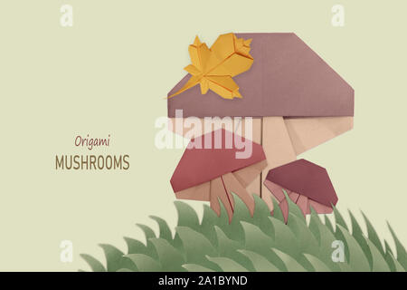 Mushroom group origami isolated on a green Stock Photo