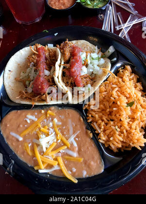 Two soft-shell Tortilla's with rice and refried beans Stock Photo