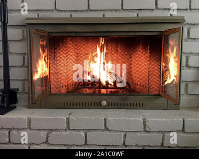 Logs burning in a fireplace on a cold winter's day Stock Photo