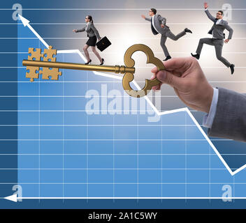 The business people chasing each other towards key to success Stock Photo