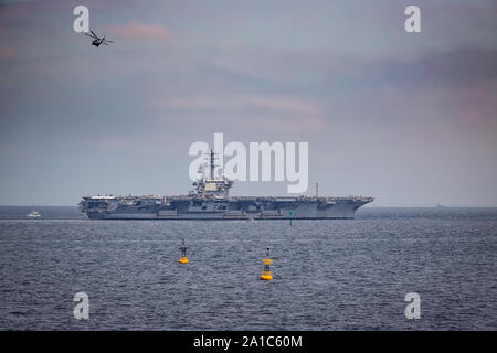 The USS Reagan heads out to sea through Tokyo Bay in Japan. Stock Photo