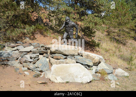 A metal statue of a Sasquatch, or Bigfoot, walking by the side of the Crowsnest Highway, near Osoyoos, British Columbia, Canada . Stock Photo
