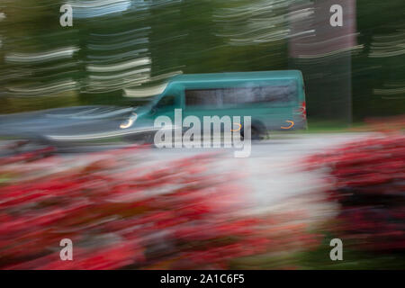 Defocused bus from a left side in movement Stock Photo