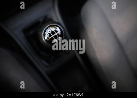Shallow depth of field image with an old and broken gear shift knob of a manual gearbox car Stock Photo