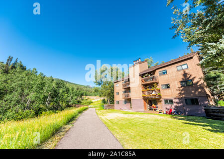 Aspen, USA - July 21, 2019: Snowmass village town in Colorado downtown with apartment condo building and Brush Creek trail with nobody in summer Stock Photo