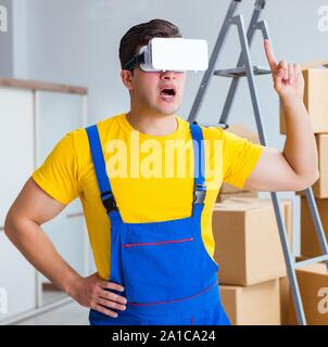 The painter contractor working with virtual reality goggles Stock Photo