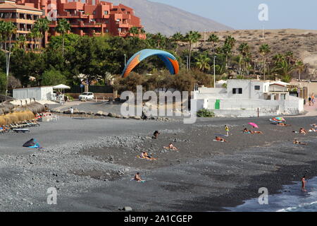 Hang glider, Wind surfer, La Caleta, Tenerife, Canary Islands, Spain; Playa de La Enramada Stock Photo