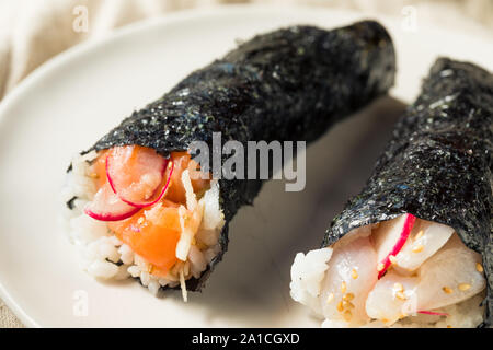 Homemade Sushi Temaki Hand Rolls with Salmon and Fish Stock Photo