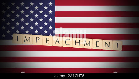 USA Politics Concept: Letter Tiles Impeachment On US Flag, 3d illustration Stock Photo