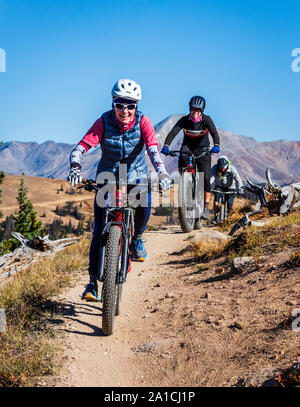 Mountain bikers on the famous Monarch Crest Trail, along the Continental Divide in Colorado, riding in a fund raiser for the Alliance Against Domestic Stock Photo