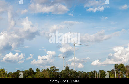 Wind turbine farm power generator in beautiful nature landscape for production of renewable green energy is friendly industry to environment. Stock Photo