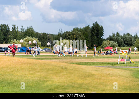 Park City, USA - July 25, 2019: School field for sports in ski resort town in Utah during summer with people playing practicing at match in summer Stock Photo
