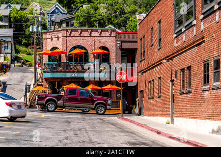 Park City, USA - July 25, 2019: Ski resort town in Utah during summer with downtown historic brick buildings street road and cars Stock Photo