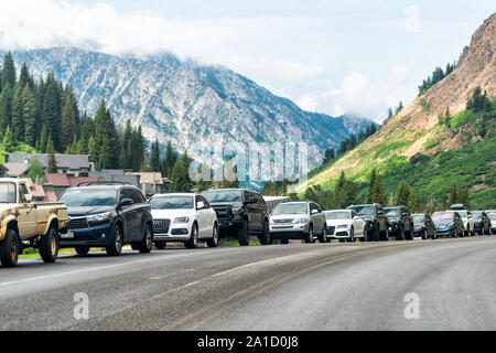 Alta, USA - July 27, 2019: Cars parked on side of the road for hiking in Albion Basin, Utah in summer at popular mountain destination Stock Photo