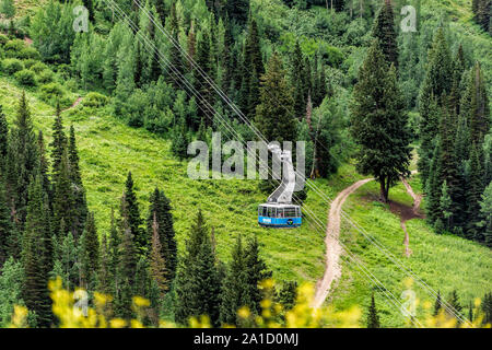 Alta, USA - July 27, 2019: Cable car gondola ride in mall ski resort town village by Albion Basin, Utah in summer and Cottonwood Canyon Stock Photo