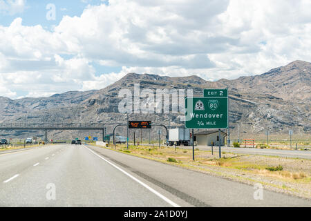 Wendover, USA - July 27, 2019: Nevada city near Bonneville Salt Flats in Utah during day with highway road and exit sign Stock Photo