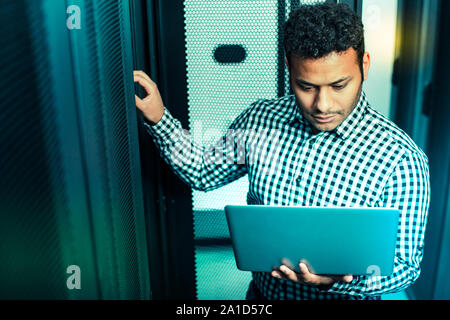 Professional senior male technician doing his job Stock Photo