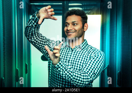 Delighted positive man using a virtual technology Stock Photo