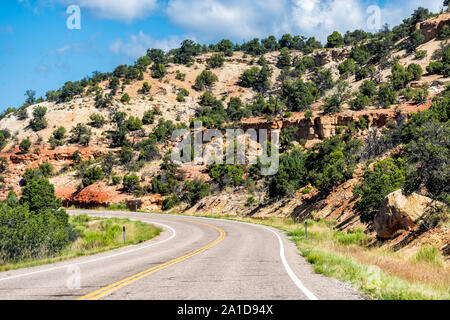 Empty highway paved winding scenic road byway in Grand Staircase Escalante National Monument with canyon formations in Utah summer Stock Photo