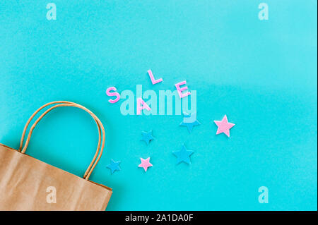 Two Kraft bags on turquoise background. Eco packaging for shopping. Season of sales and discounts Stock Photo