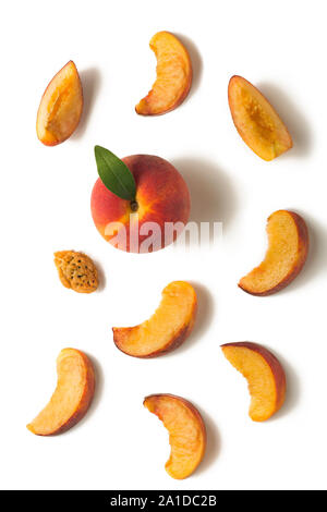 Fruit set. Ripe peach, peach slices, peach kernel on a white background Stock Photo