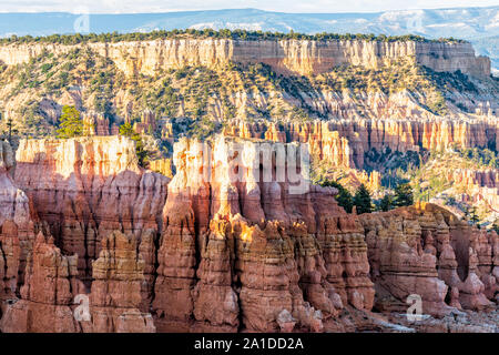 Landscape view of hoodoos rock formations in Bryce Canyon National Park at sunset with patterns and sunlight from overlook Stock Photo