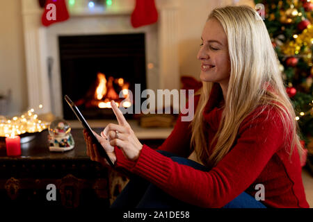 Woman at home at Christmas time Stock Photo