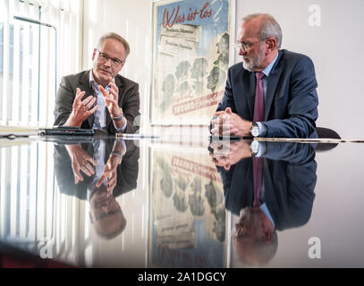 20 September 2019, Hessen: Carsten Knop, Editor-in-Chief of Digitale Produkte (l), and Berthold Kohler, publisher of the Frankfurter Allgemeine Zeitung (FAZ, r), are sitting at the table in the editorial offices during an interview. The newspaper celebrates its 70th anniversary. Photo: Frank Rumpenhorst/dpa Stock Photo