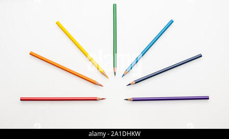 Color pencils rainbow colors in the form of a fan on a white background top view Stock Photo