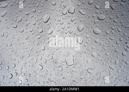 Water droplets stick on the glass surface. Stock Photo