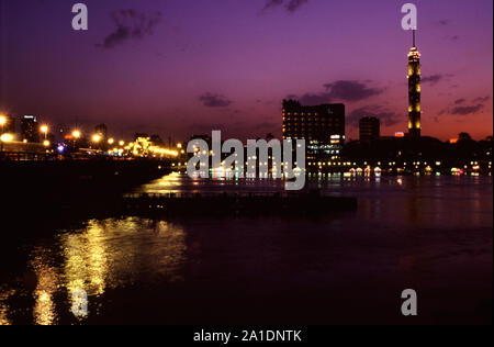 View at twilight of Qasr El Nil Bridge and Zamalek an affluent district encompassing the northern portion of Gezira Island in Cairo Egypt Stock Photo