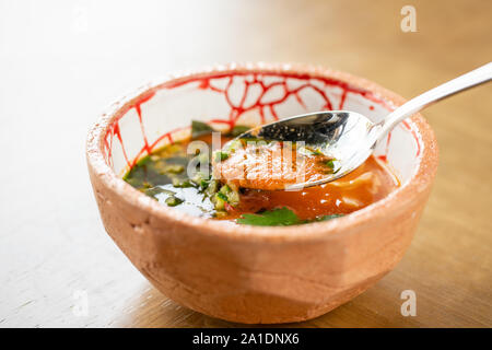 Traditional french eclairs with chocolate. Cake decorated with chocolate cream on top of are on a wooden table Stock Photo