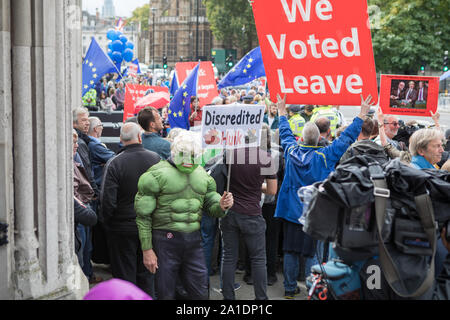 Westminster, London, UK. 25 September 2019. Pro-Europe protester wears 'The Hulk' outfit resembling Boris Johnson. Remain and leave protesters demonstrate outside the House of Parliament.  MPs return to Parliament the day after the Supreme Court declared that Boris Johnson proroguing of Parliament was unlawful.  MPs debate in the House the outcome of the Supreme Court decision and the Prime Minister Boris Johnson faces questions from MPs. Stock Photo