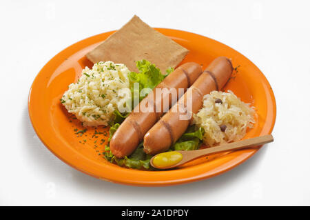 plate with German sausages, mashed potatoes and sour cabbage Stock Photo