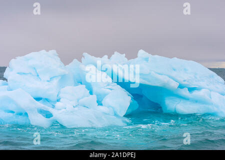 Blue Iceberg drifting in Hinlopen Strait, Spitsbergen Island, Svalbard archipelago, Norway Stock Photo