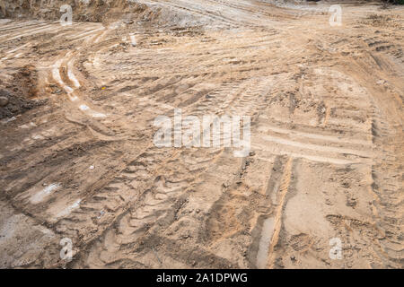 Construction background with dirt soil and tire tracks. Construction Working site Stock Photo