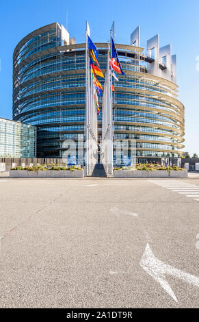 Entrance of the Louise Weiss building, seat of the European Parliament, and flags of the member states of the European Union in Strasbourg, France.
