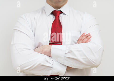 A man in a shirt holds his hands on his chest. making negative opinion. dissatisfaction concept. Stock Photo