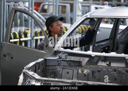 Russia. 24th Sep, 2019. KALUGA REGION, RUSSIA - SEPTEMBER 24, 2019: A worker on a car assembly line at the PCMA Rus car plant in Rosva Industrial Park in Kaluga Region, Russia; the car factory was inaugurated as a joint project by PSA Peugeot Citroen and Mitsubishi Motors Corporation in 2009, currently it has the production capacity of 125,000 vehicles per year and manufactures the Pajero Sport and SUV Outlander for the Mitsubishi Motors Corporation, and a number of vehicles for the PSA Group. Sergei Bobylev/TASS Credit: ITAR-TASS News Agency/Alamy Live News